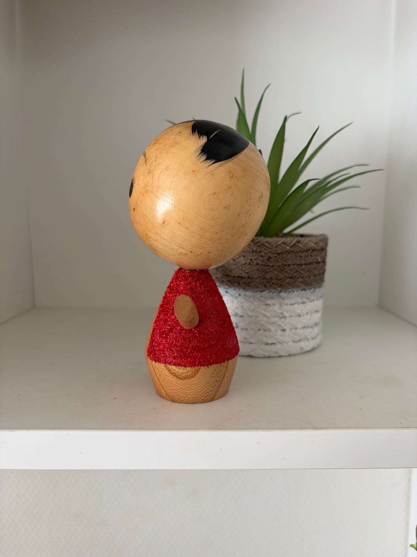 Cute sosaku kokeshi with red glitter jacket