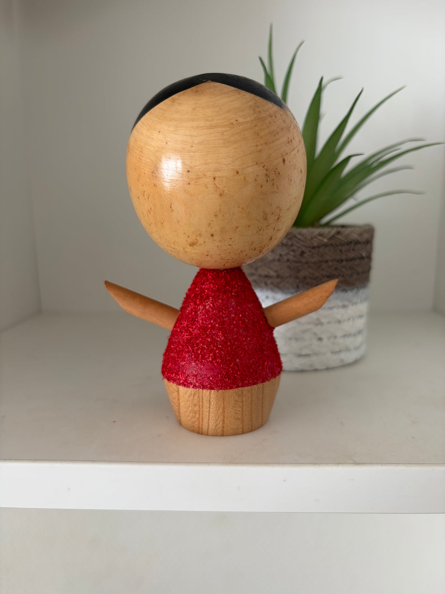 Cute sosaku kokeshi with red glitter jacket