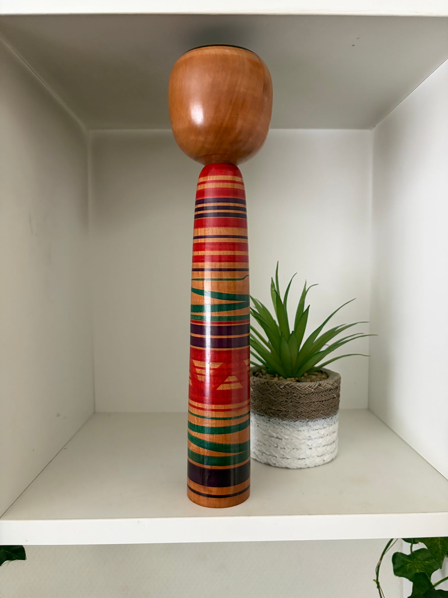 Vintage traditional Tsuchiyu kokeshi with striped design