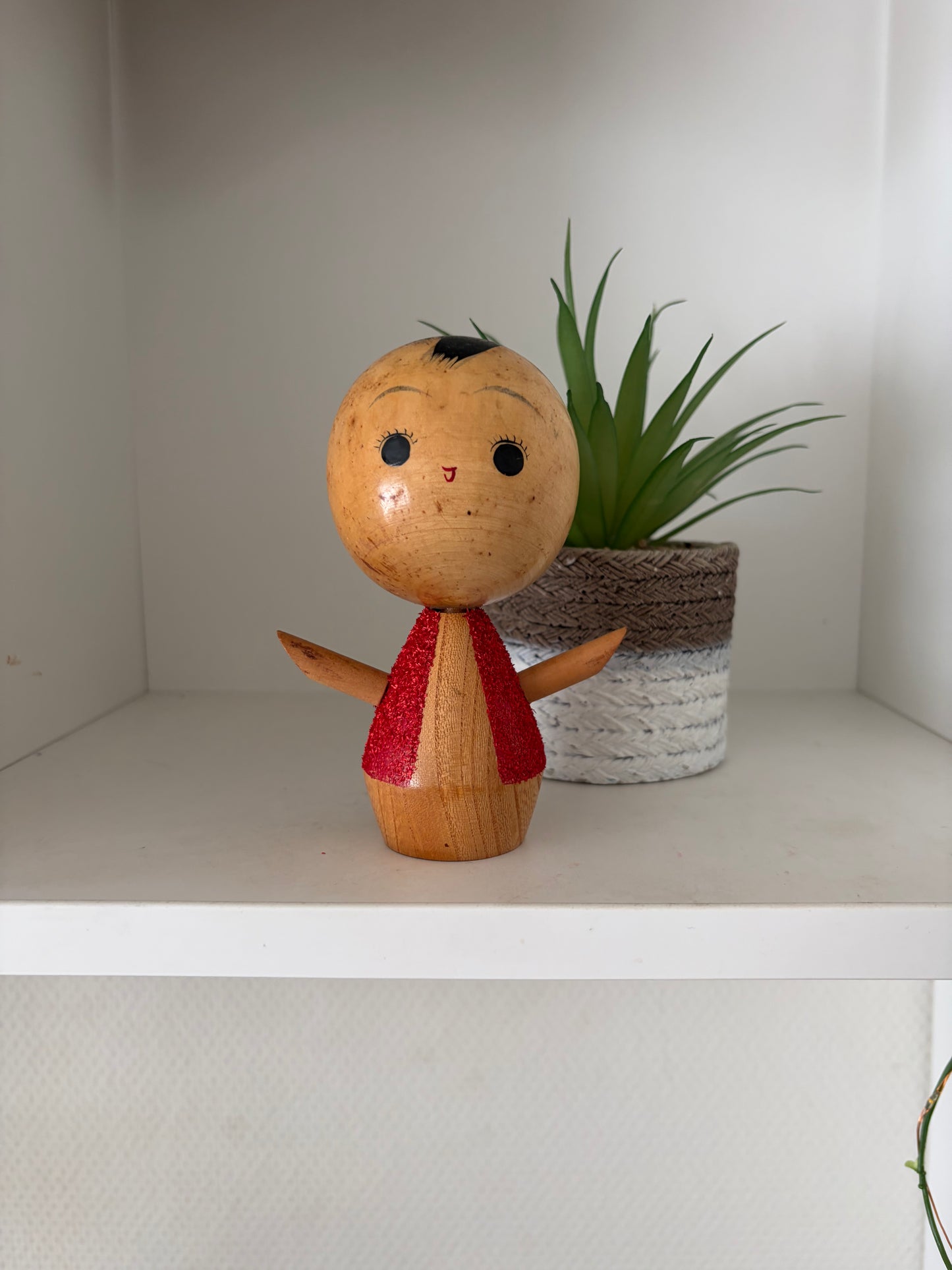 Cute sosaku kokeshi with red glitter jacket