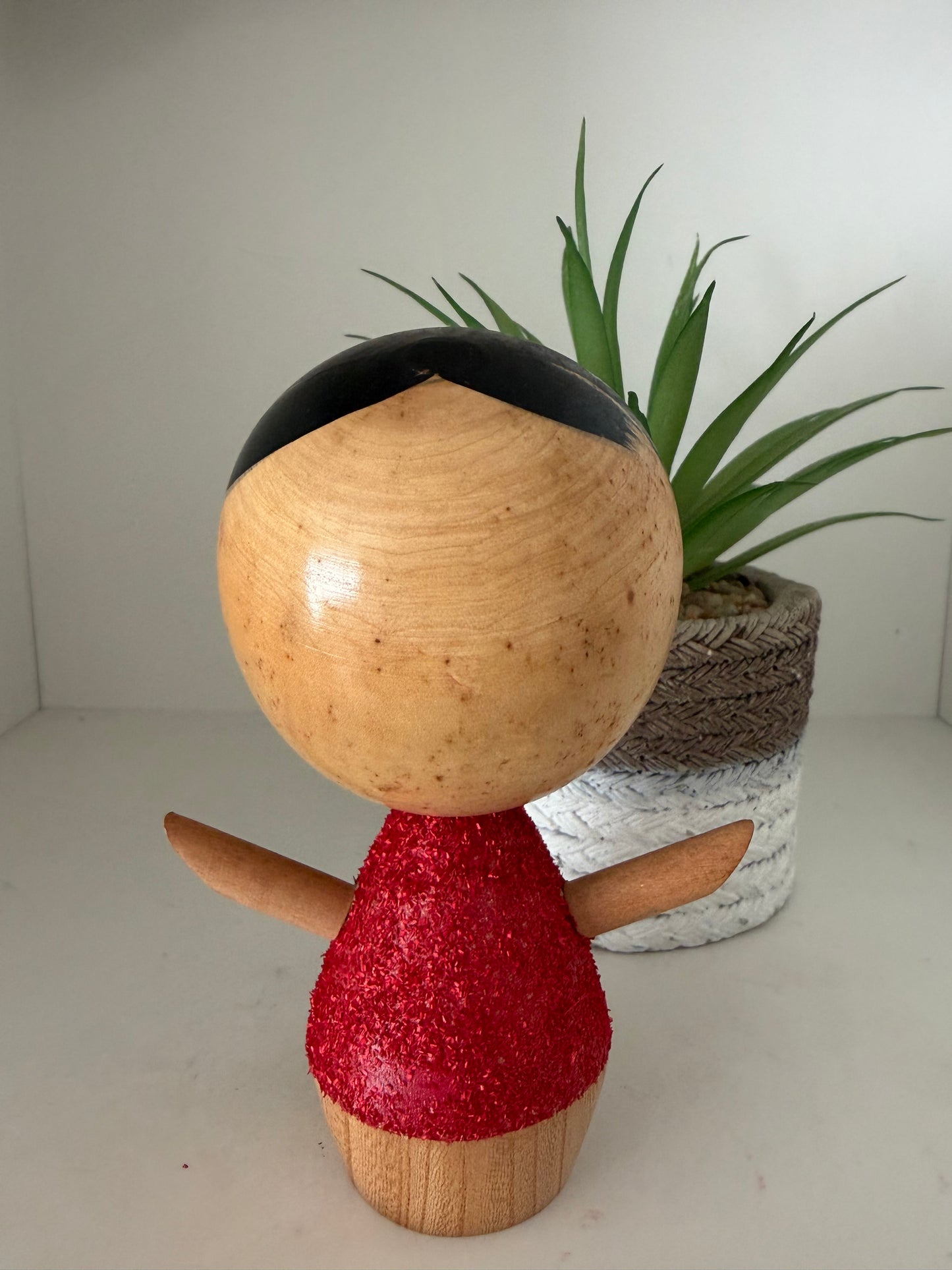Cute sosaku kokeshi with red glitter jacket