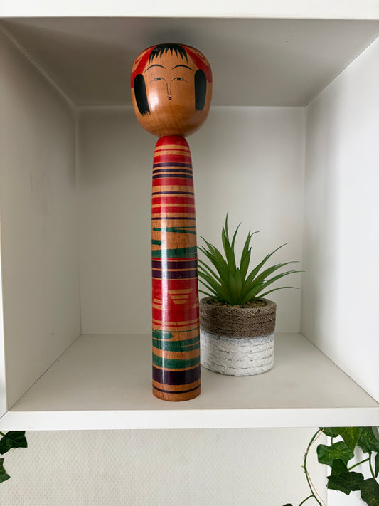 Vintage traditional Tsuchiyu kokeshi with striped design
