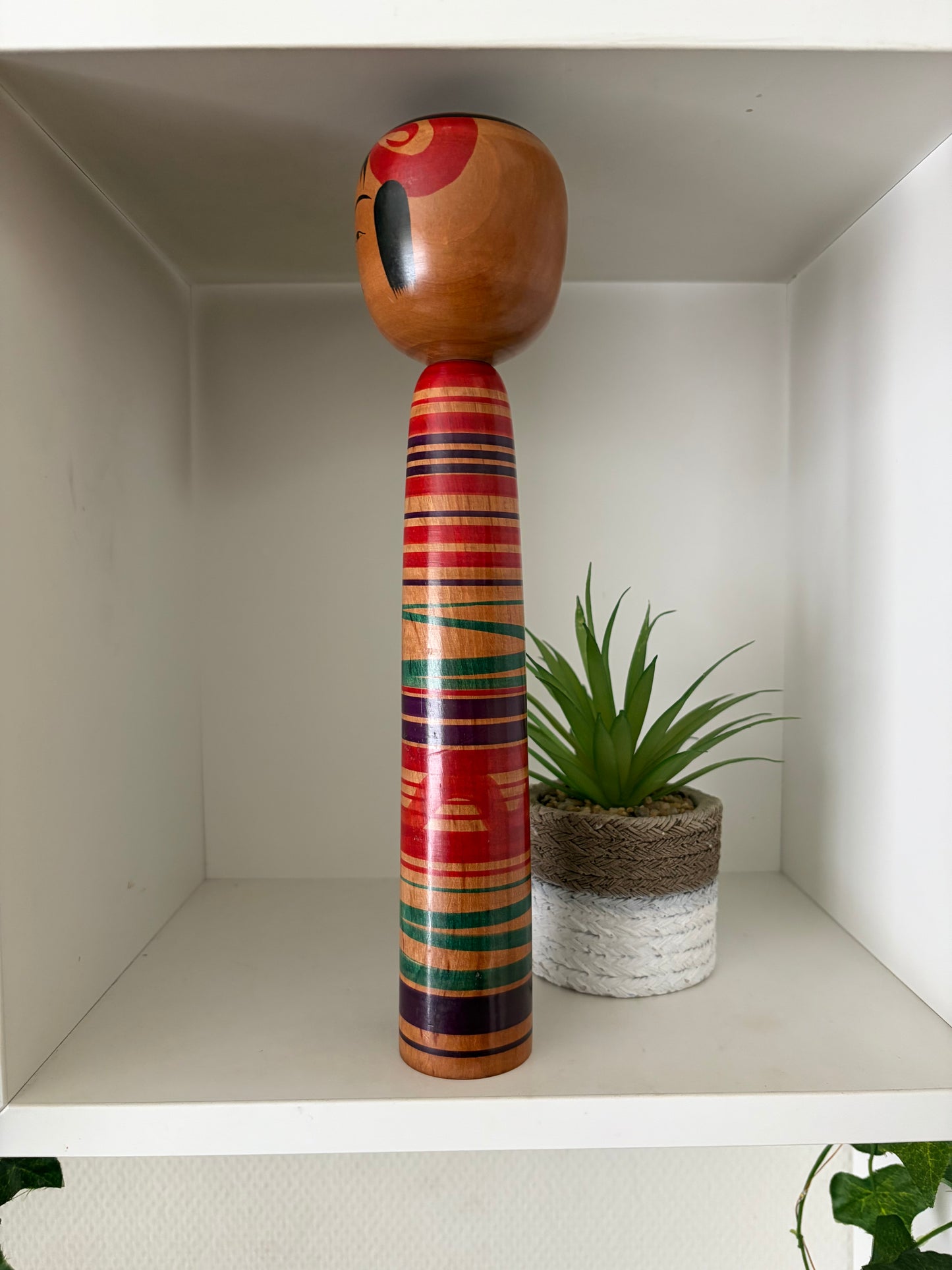 Vintage traditional Tsuchiyu kokeshi with striped design