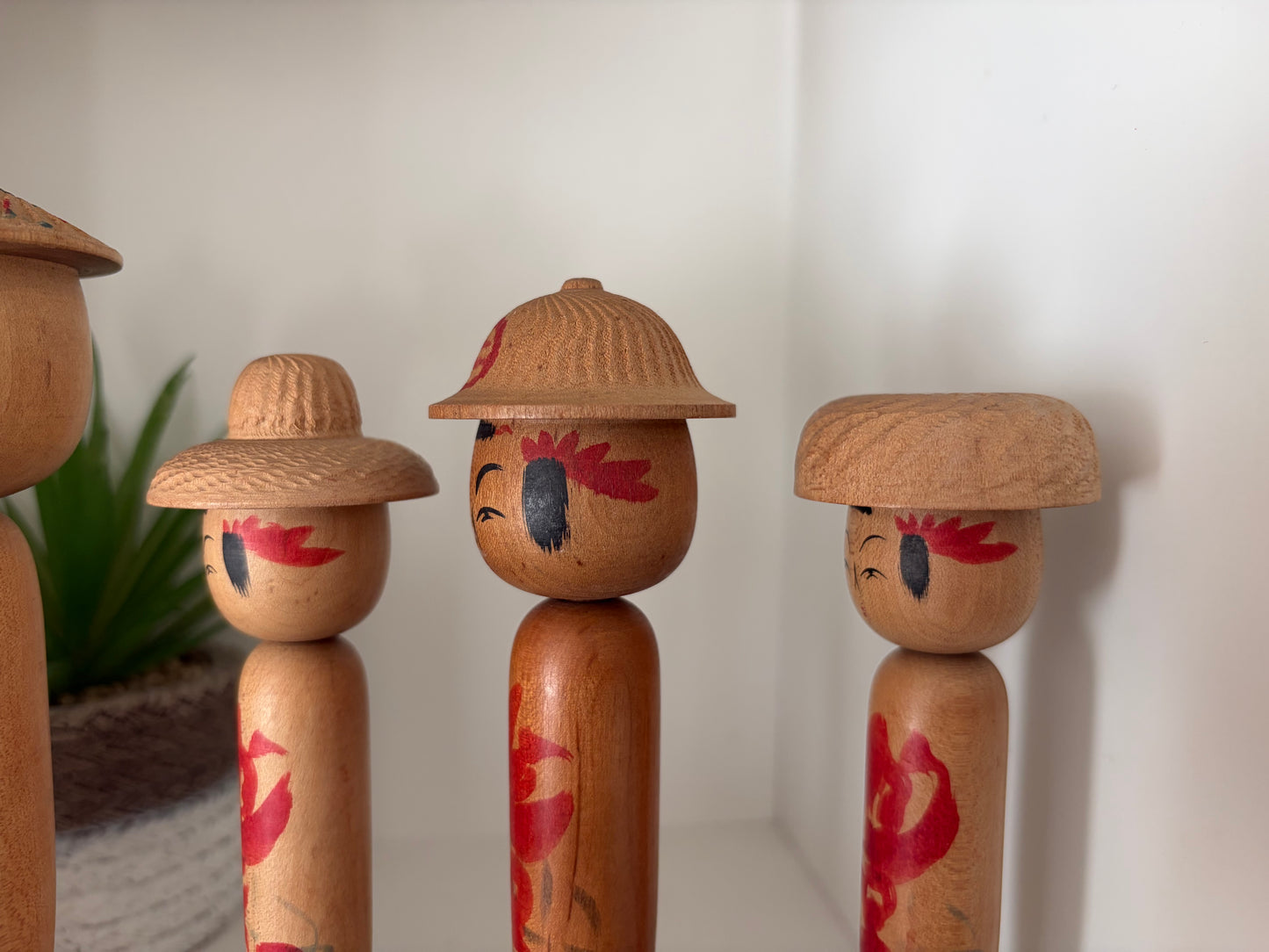 Vintage set of six Yamagata kokeshi with hat by Seijiro Kobayashi (1918-2015)