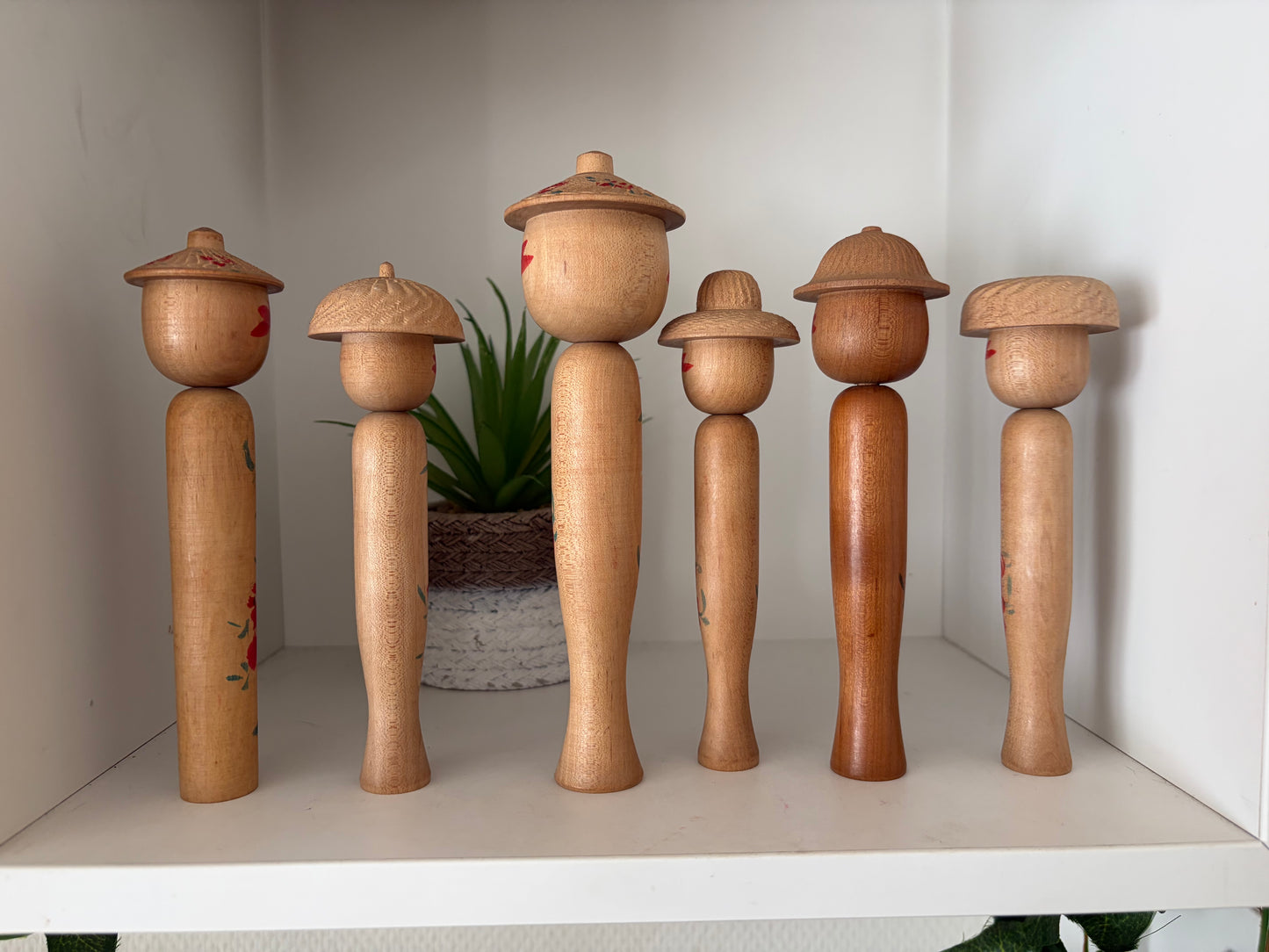 Vintage set of six Yamagata kokeshi with hat by Seijiro Kobayashi (1918-2015)