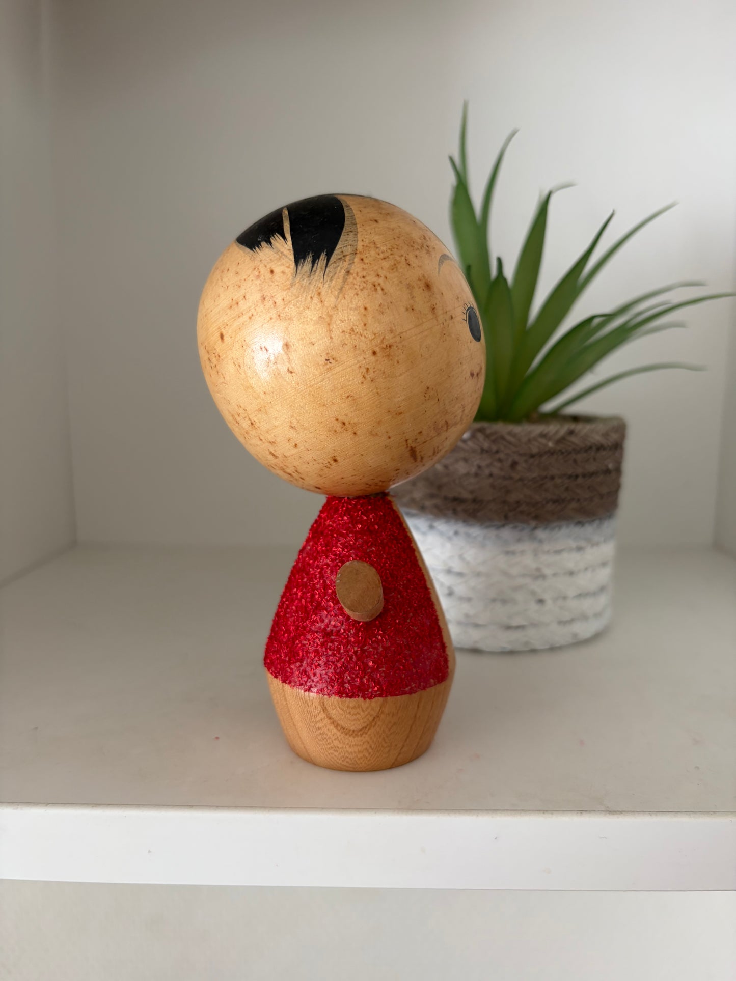 Cute sosaku kokeshi with red glitter jacket