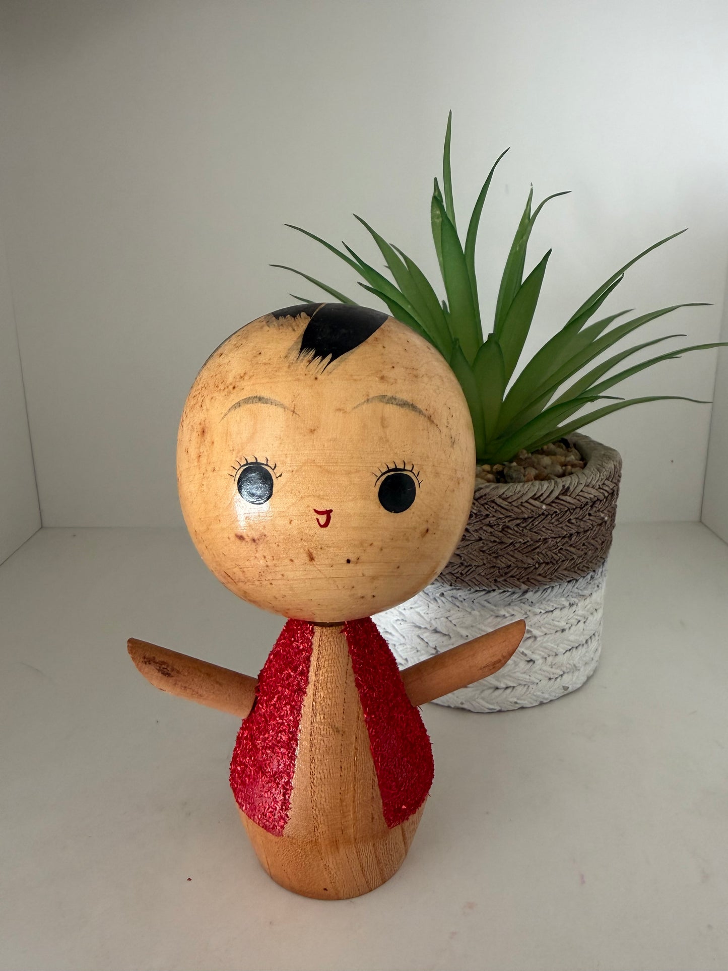 Cute sosaku kokeshi with red glitter jacket