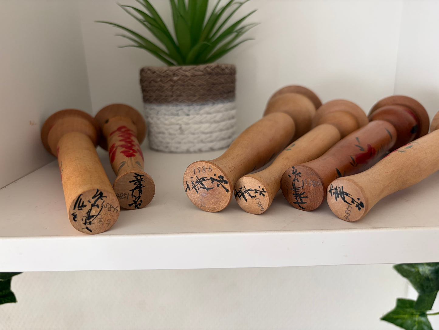 Vintage set of six Yamagata kokeshi with hat by Seijiro Kobayashi (1918-2015)