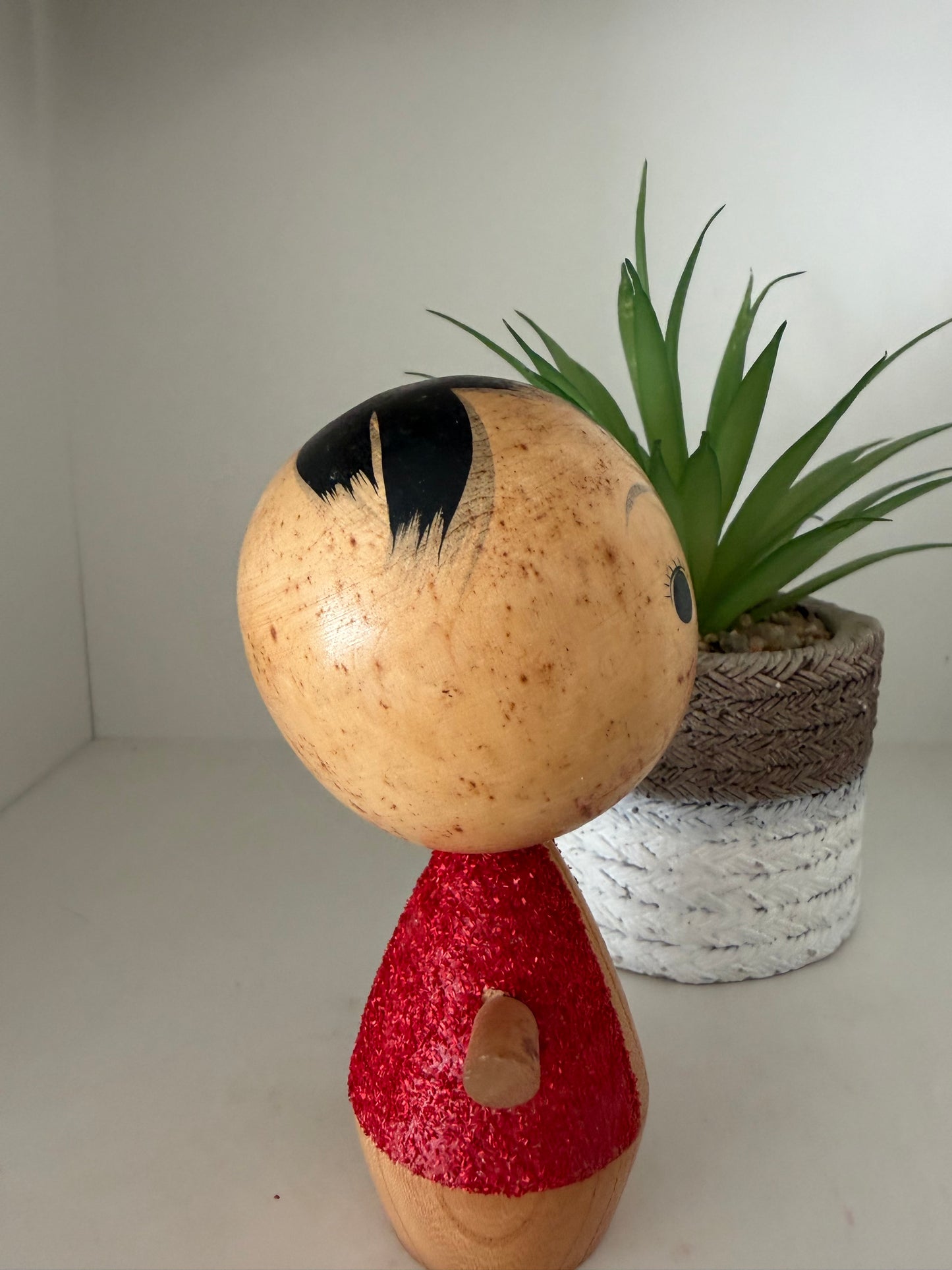 Cute sosaku kokeshi with red glitter jacket