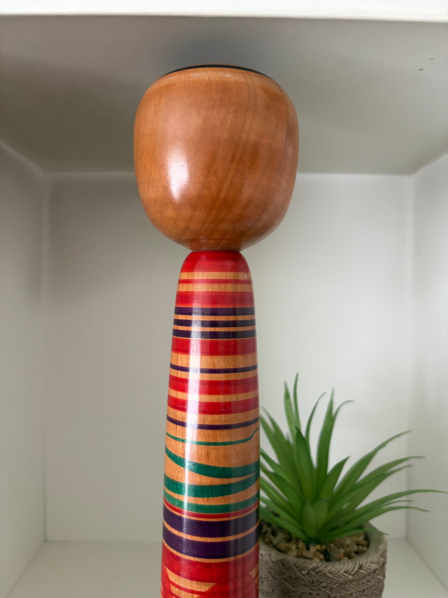 Vintage traditional Tsuchiyu kokeshi with striped design