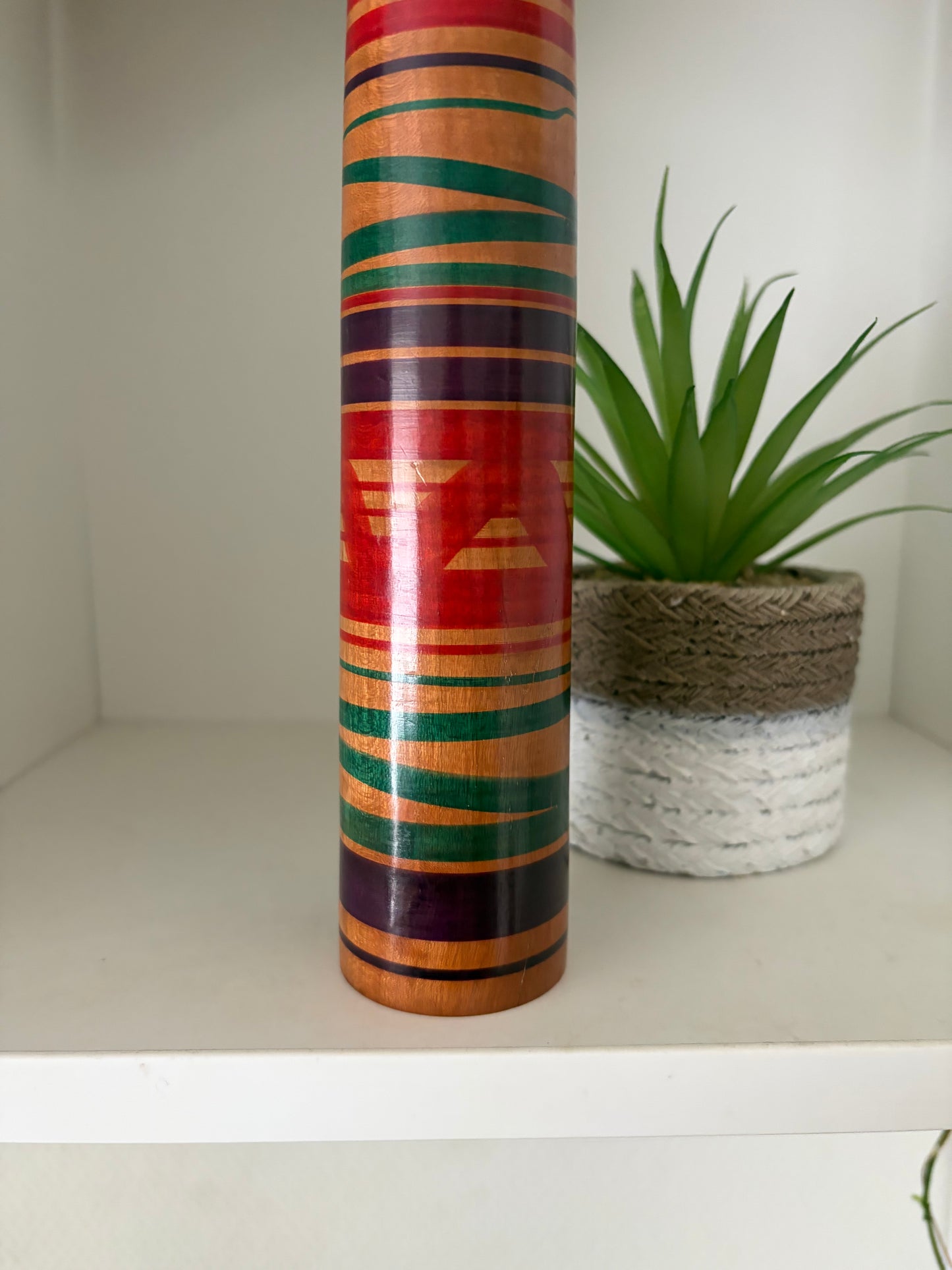 Vintage traditional Tsuchiyu kokeshi with striped design