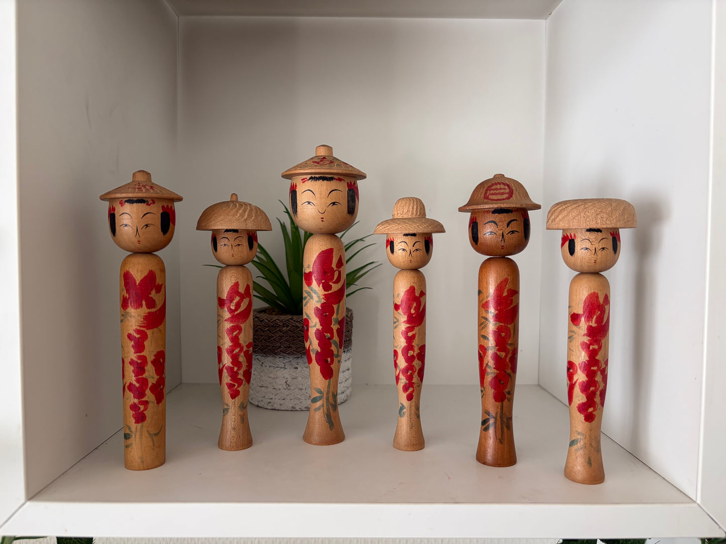 Vintage set of six Yamagata kokeshi with hat by Seijiro Kobayashi (1918-2015)
