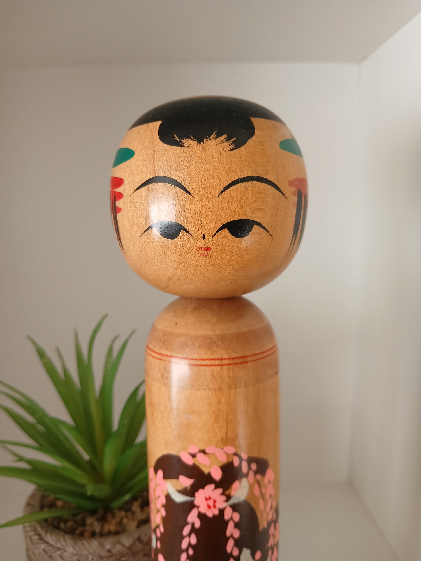 Vintage Shingata kokeshi with Wisteria design