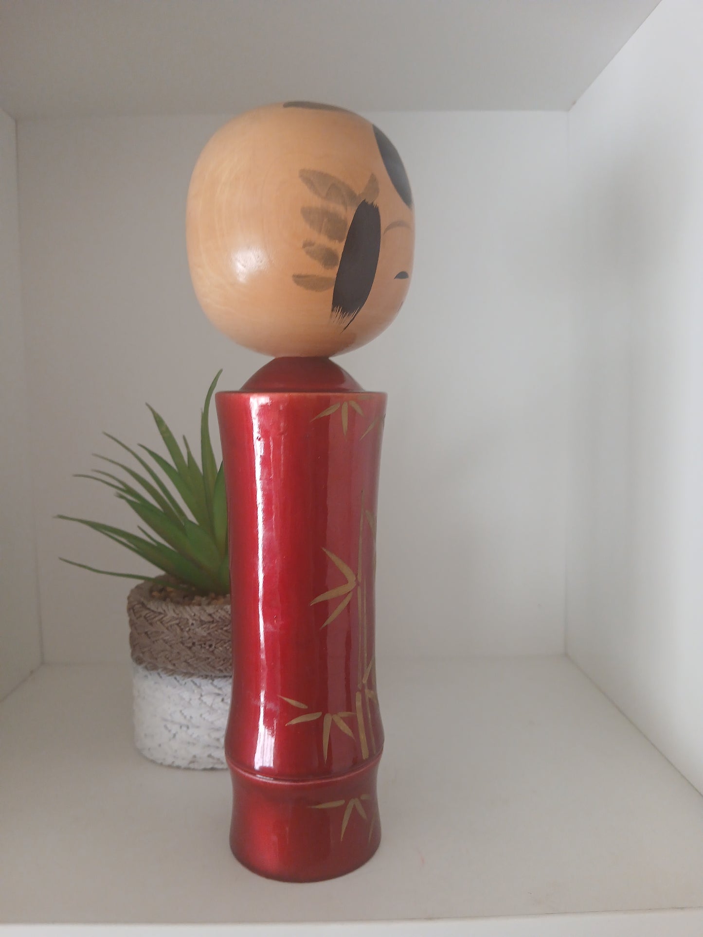 Lovely vintage red lacquer kokeshi by Takahashi Tatsuro