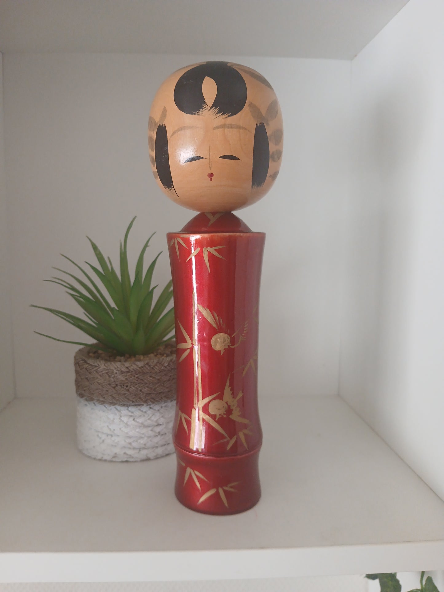 Lovely vintage red lacquer kokeshi by Takahashi Tatsuro