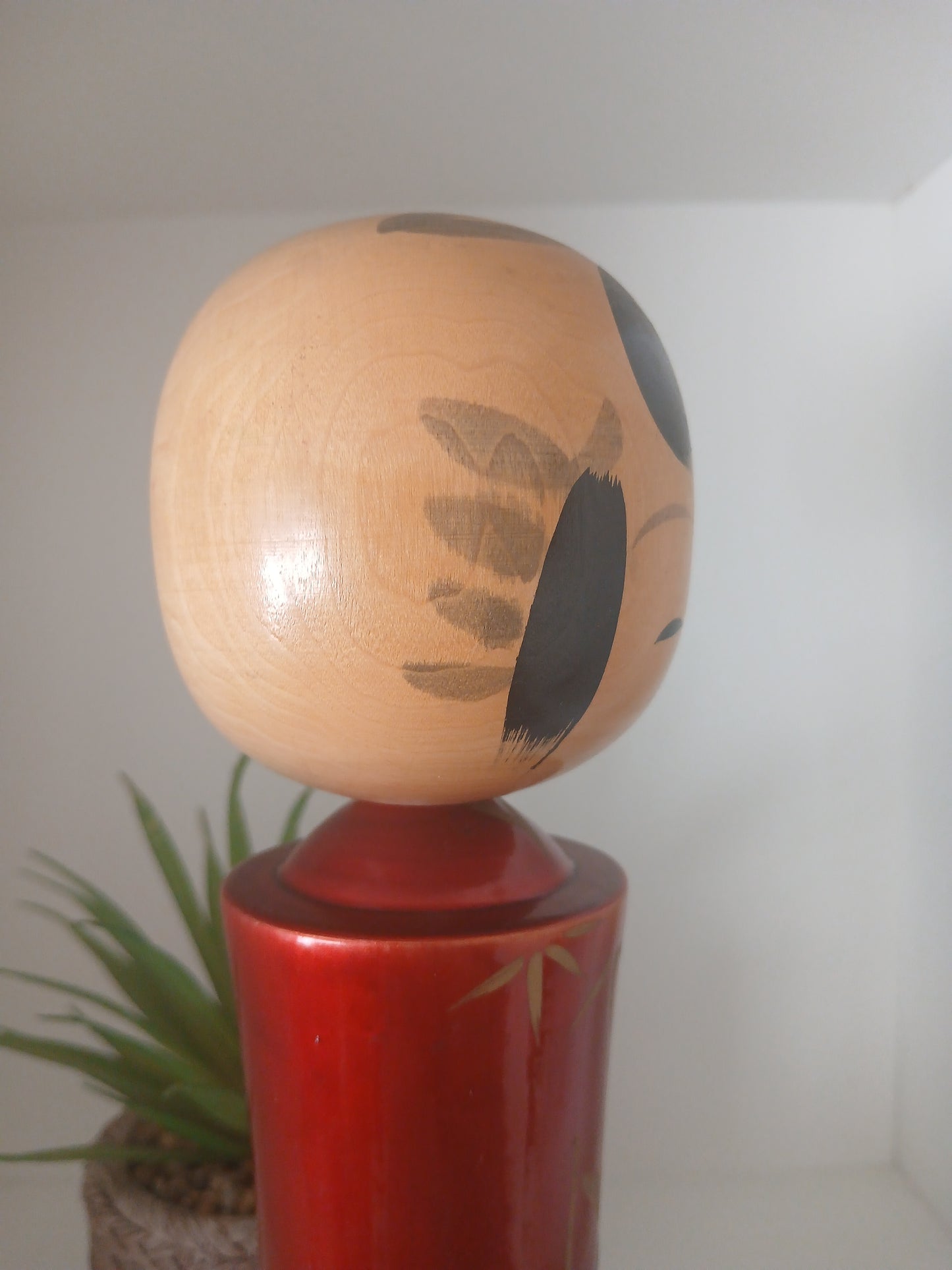 Lovely vintage red lacquer kokeshi by Takahashi Tatsuro