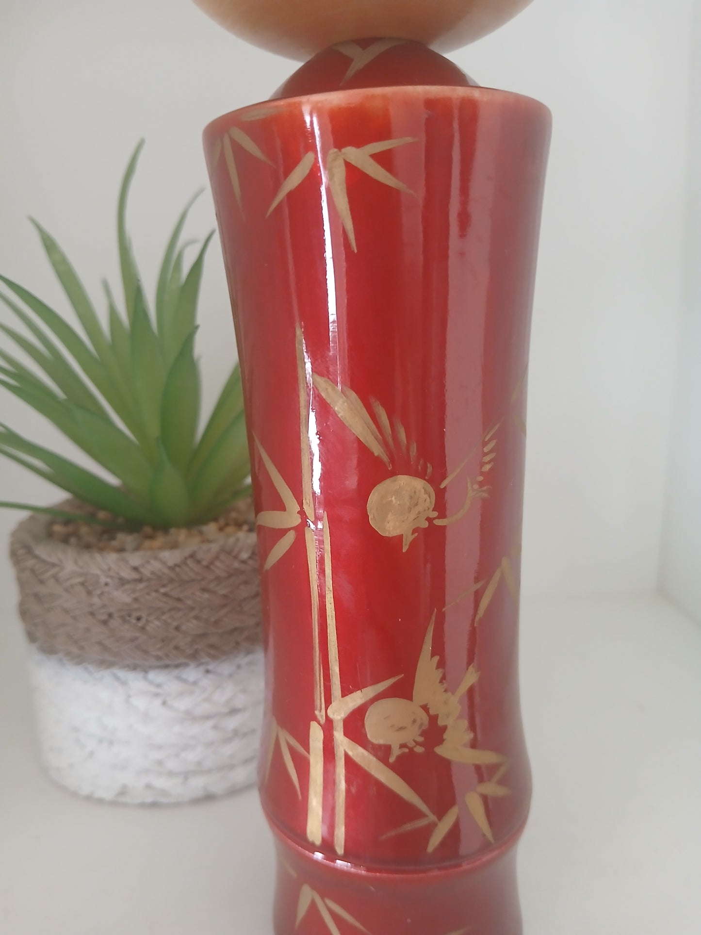 Lovely vintage red lacquer kokeshi by Takahashi Tatsuro