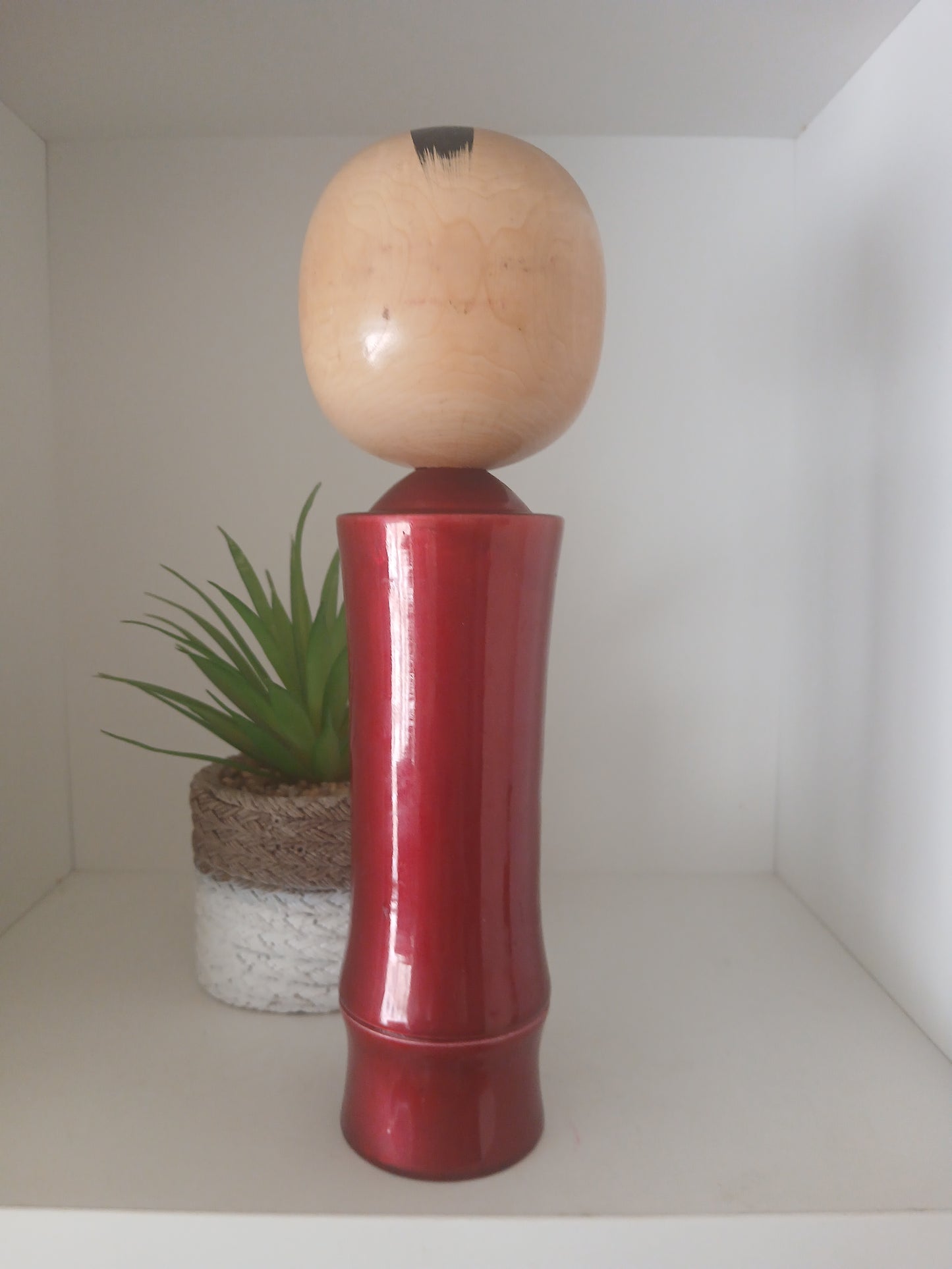 Lovely vintage red lacquer kokeshi by Takahashi Tatsuro