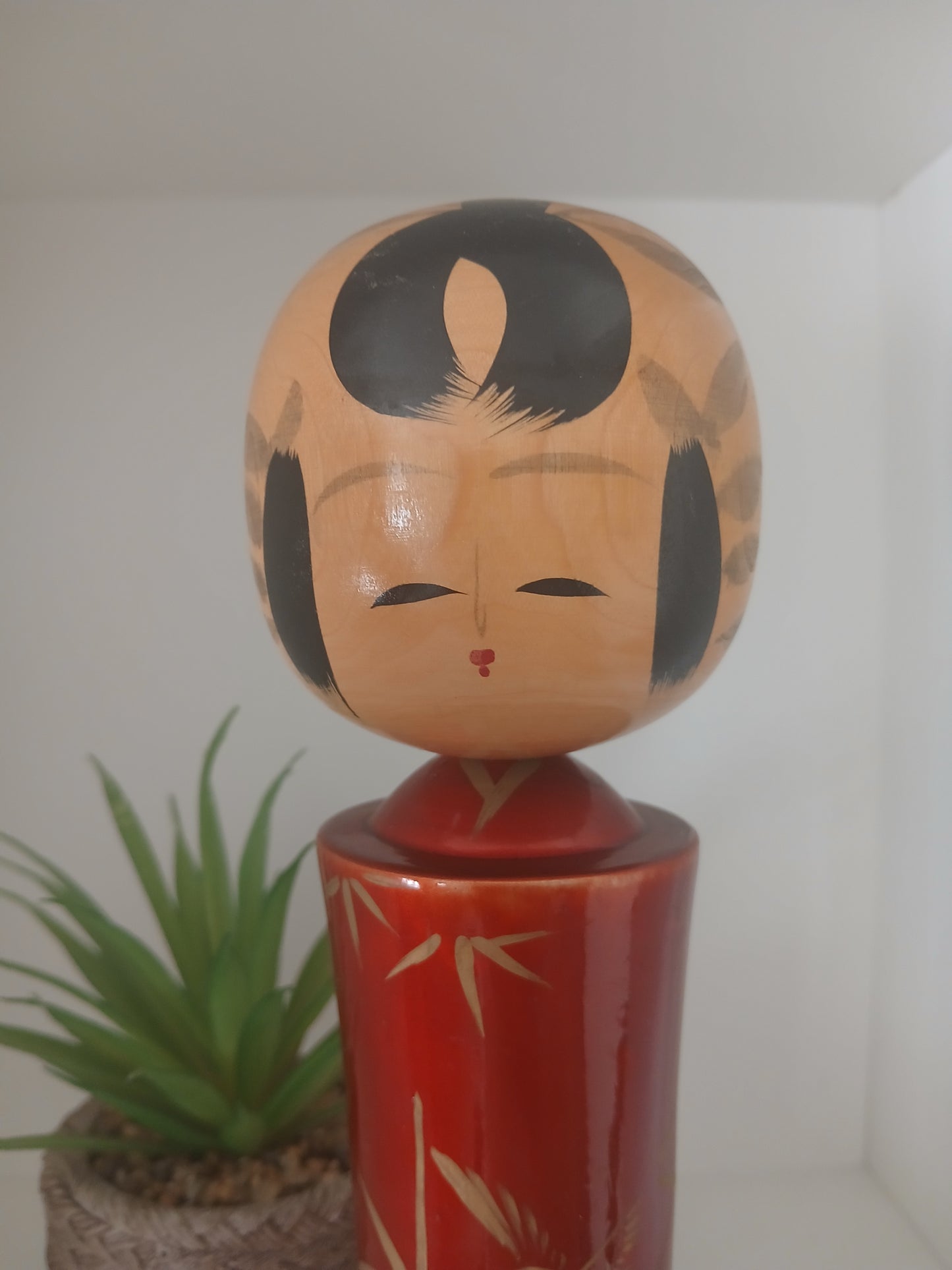 Lovely vintage red lacquer kokeshi by Takahashi Tatsuro